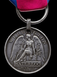 Waterloo Medal with original steel clip, and split ring suspension, awarded to Private William Smith