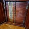 Antique Coin Cabinet A stunning mahogany coin cabinet, ex Baldwin values, size approx 30 x 39 x 30cm, comprising 27 trays double-pierced
