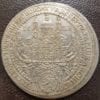 Thaler Habsburg Empire Cathedral dividing dates (16-28) held by Saint Rupert and Saint Virgil. Arms of Count Paris of Lodron below